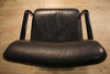 Designer armchair in plastic and fake leather