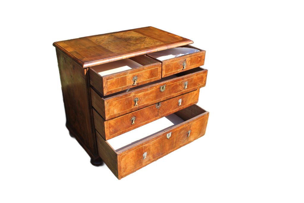 front view of early 18th century burr walnut chest with three short and three long drawers