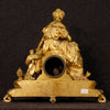 French clock in golden antimony