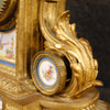 French clock in gilded bronze and brass with painted ceramic